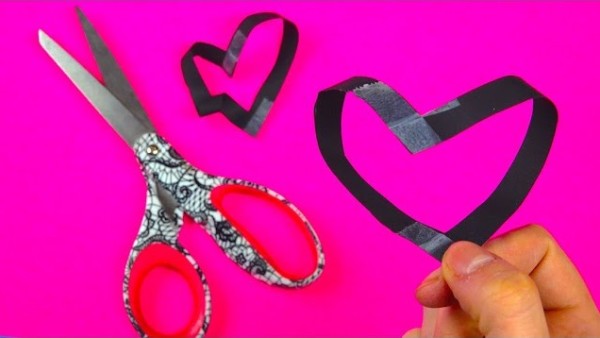 Screenshot of Magic Heart Love Test - using two strips of paper, tape, and scissors.